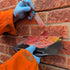 The two part, colour mixed resin being applied to a cracked brick wall.